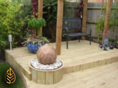 Decking with integrated water feature and pergola.